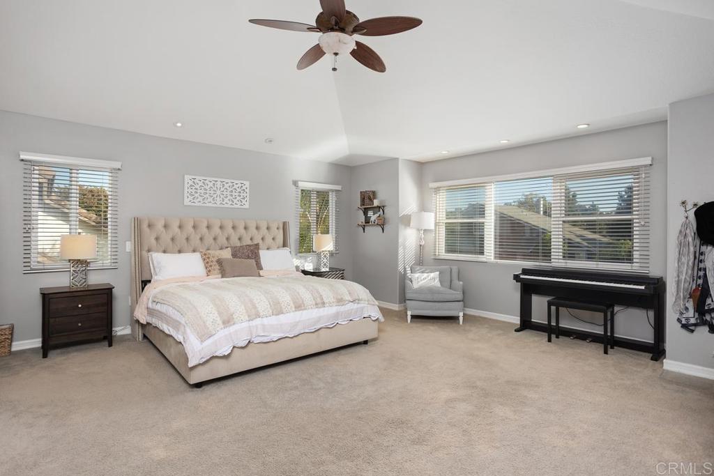 2804 Jacaranda Avenue Carlsbad, CA 92009 - Photo 27 of 36 a spacious bedroom with a bed and a window