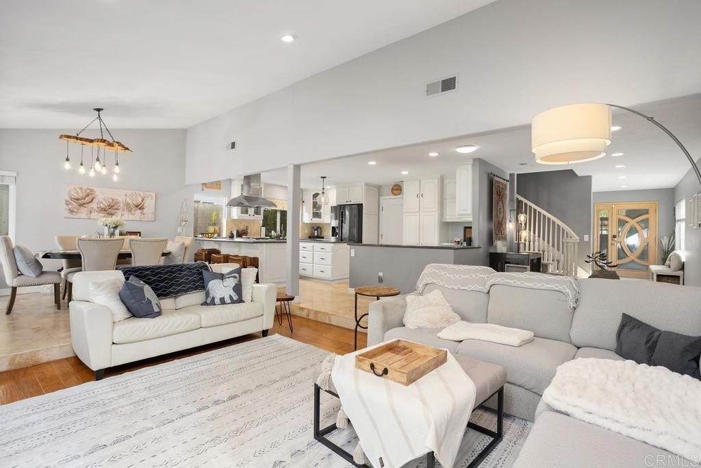 2804 Jacaranda Avenue Carlsbad, CA 92009 - Photo 8 of 36 a living room with furniture and a chandelier