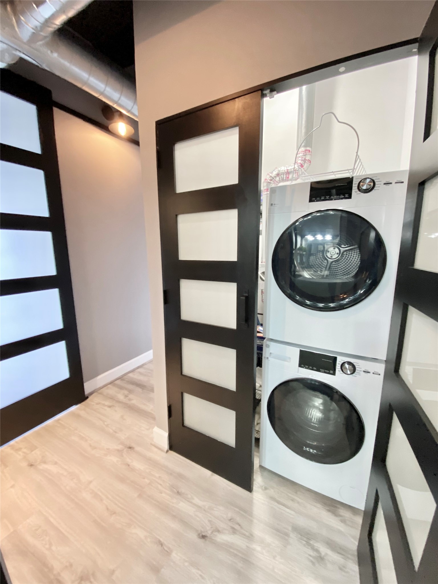 2016 Main Street, Unit 1715 Houston, TX 77002 - Photo 4 of 31 Washer and Dryer - Hallway and utility closet