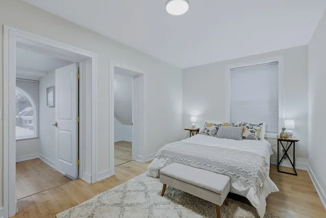 a bedroom with a bed and a view of bathroom