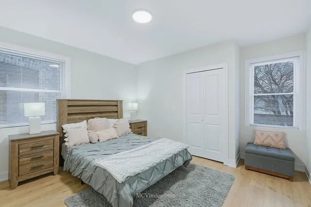 a bedroom with a bed and a couch