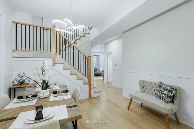 a bedroom with furniture and wooden floor