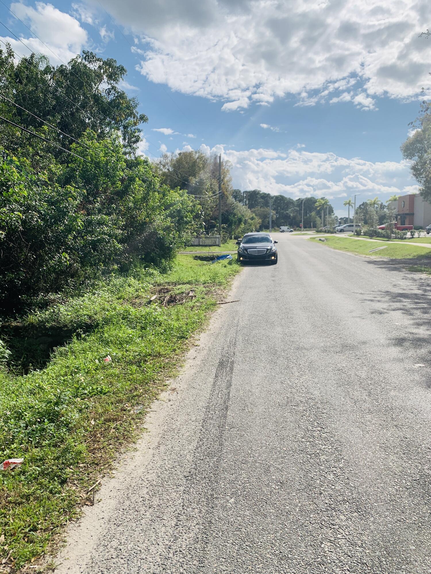 a view of a street with an ocean view