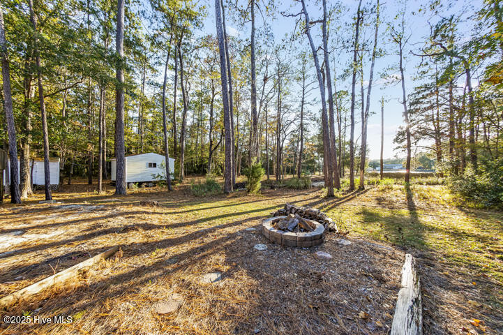 139 Sunset Avenue Merritt, NC 28556 - Photo 53 of 60 Backyard and Fire Pit