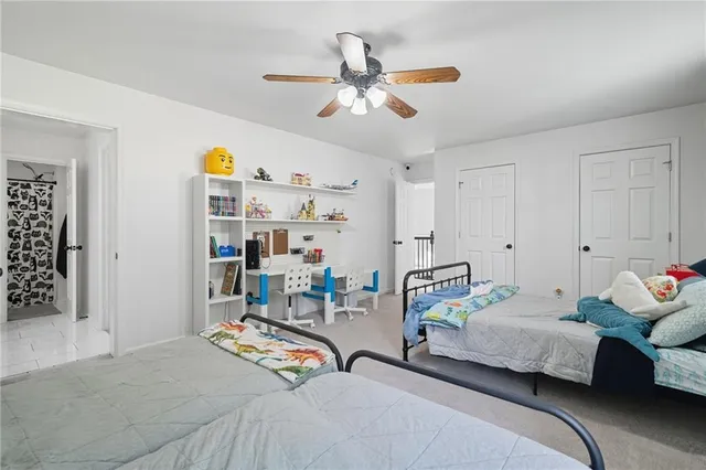 a bedroom with bed and window