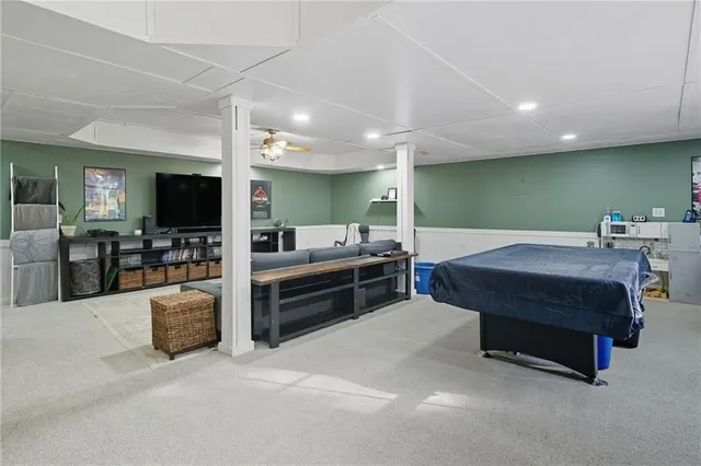 a room with furniture and a flat screen tv