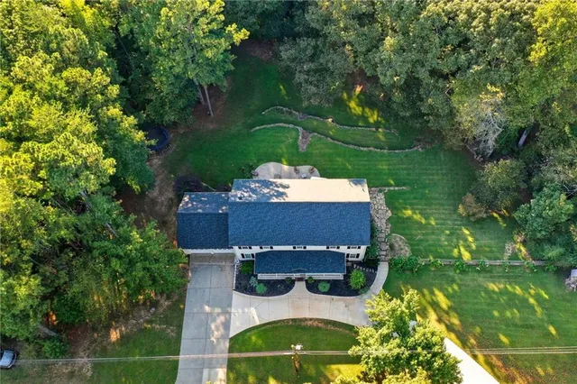an aerial view of a house with a garden