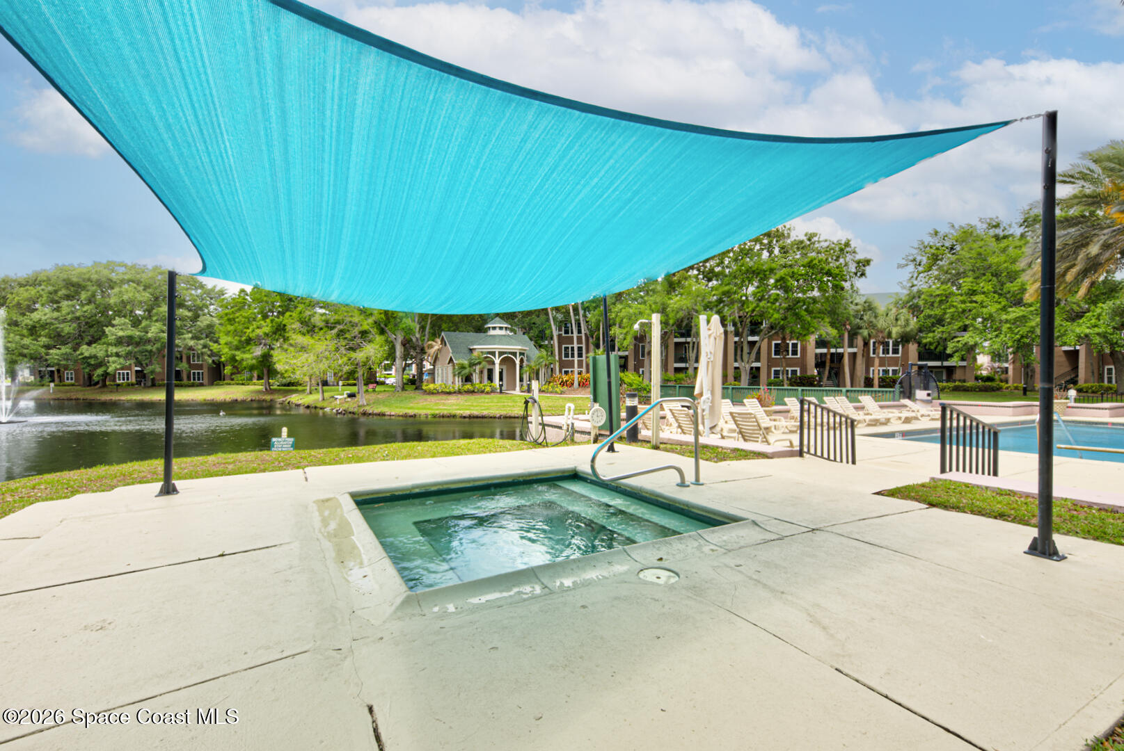 7667 North Wickham Road, Unit 1416 Melbourne, FL 32940 - Photo 29 of 41 a swimming pool with an outdoor seating and yard