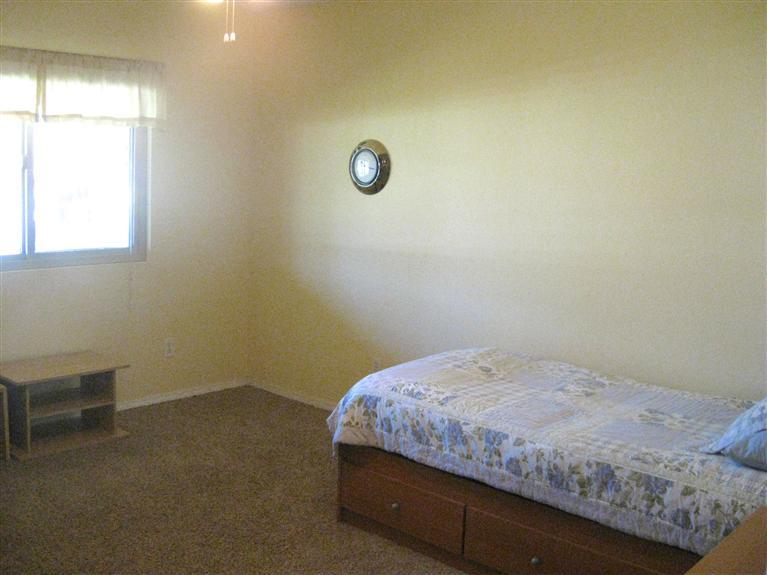 210 Burnham Road Oak View, CA 93022 - Photo 11 of 17 a bedroom with a bed and a window