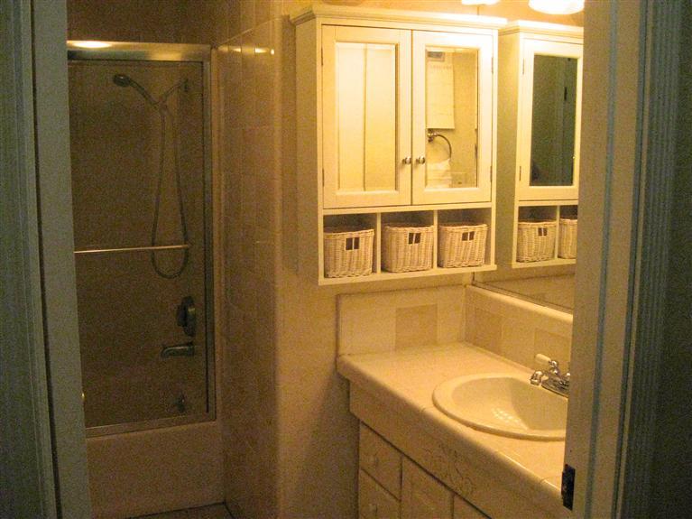 210 Burnham Road Oak View, CA 93022 - Photo 12 of 17 a bathroom with a granite countertop sink and a window