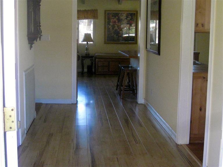 210 Burnham Road Oak View, CA 93022 - Photo 6 of 17 a hallway with wooden floor furniture and windows