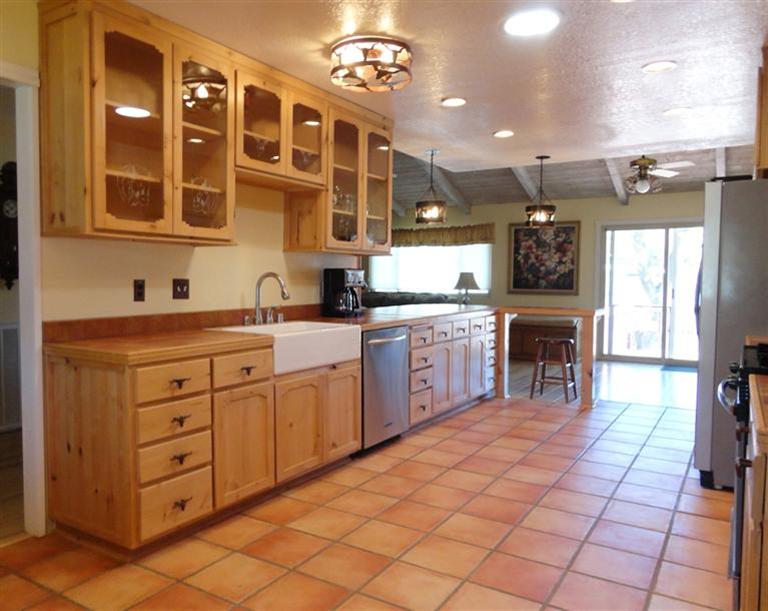 210 Burnham Road Oak View, CA 93022 - Photo 7 of 17 a kitchen with stainless steel appliances a sink stove and cabinets
