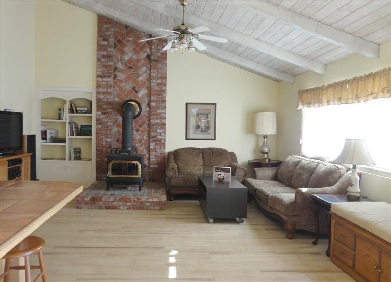 210 Burnham Road Oak View, CA 93022 - Photo 8 of 17 a living room with furniture and a fireplace
