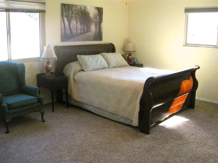 210 Burnham Road Oak View, CA 93022 - Photo 10 of 17 a bed sitting in a bedroom next to a window