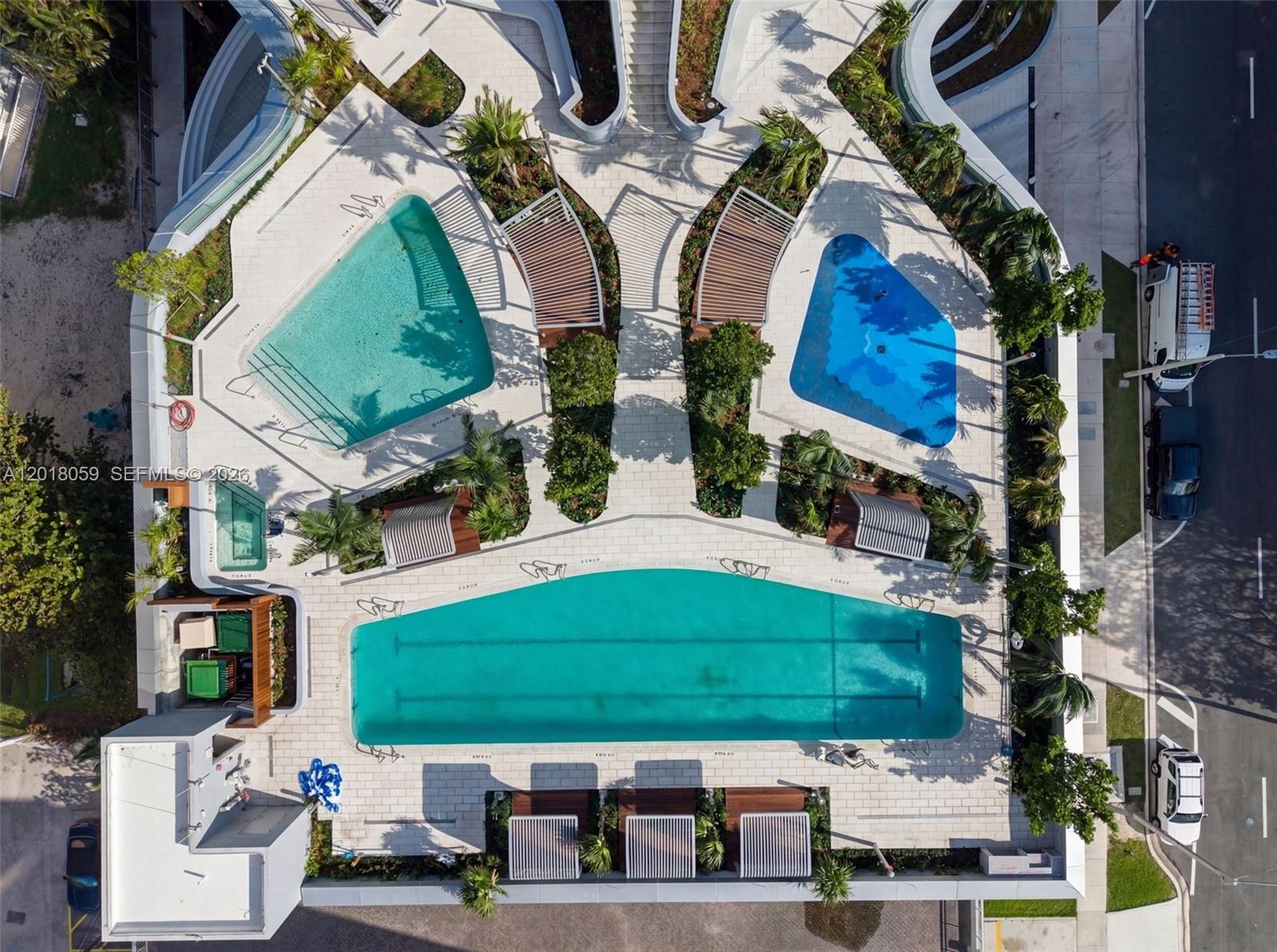 175 Southeast 25th Road, Unit 1004 Miami, FL 33129 - Photo 28 of 40 a aerial view of a house with a yard and potted plants