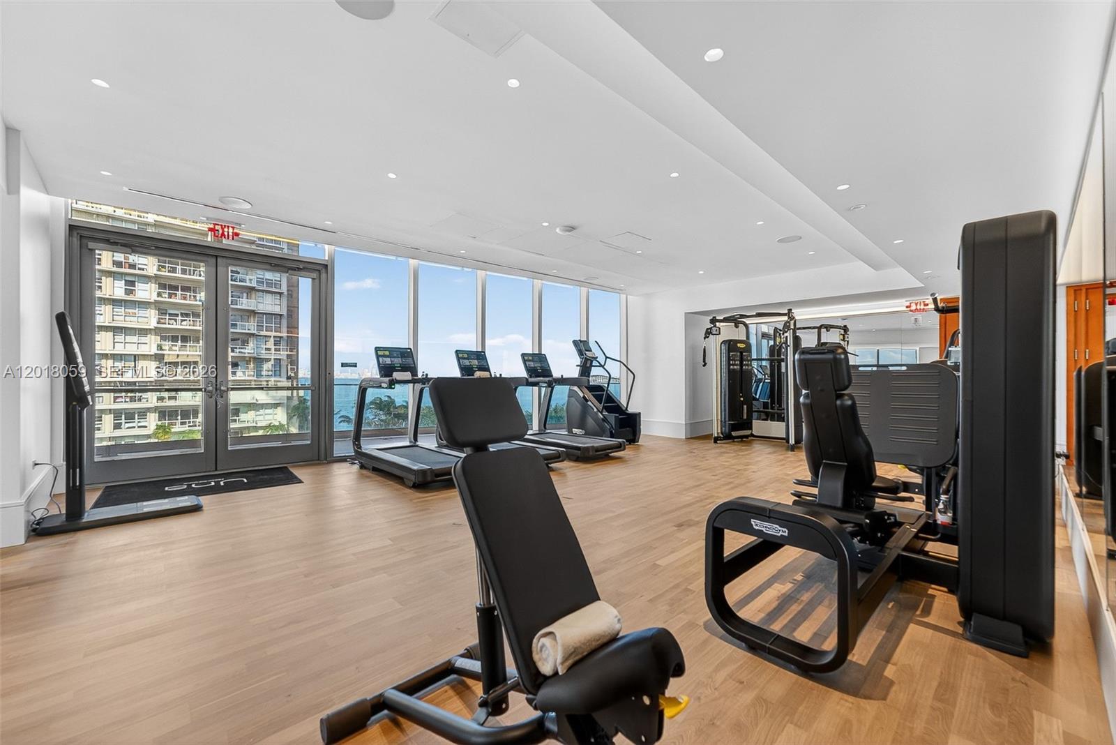 175 Southeast 25th Road, Unit 1004 Miami, FL 33129 - Photo 32 of 40 a workspace with furniture hardwood and a window