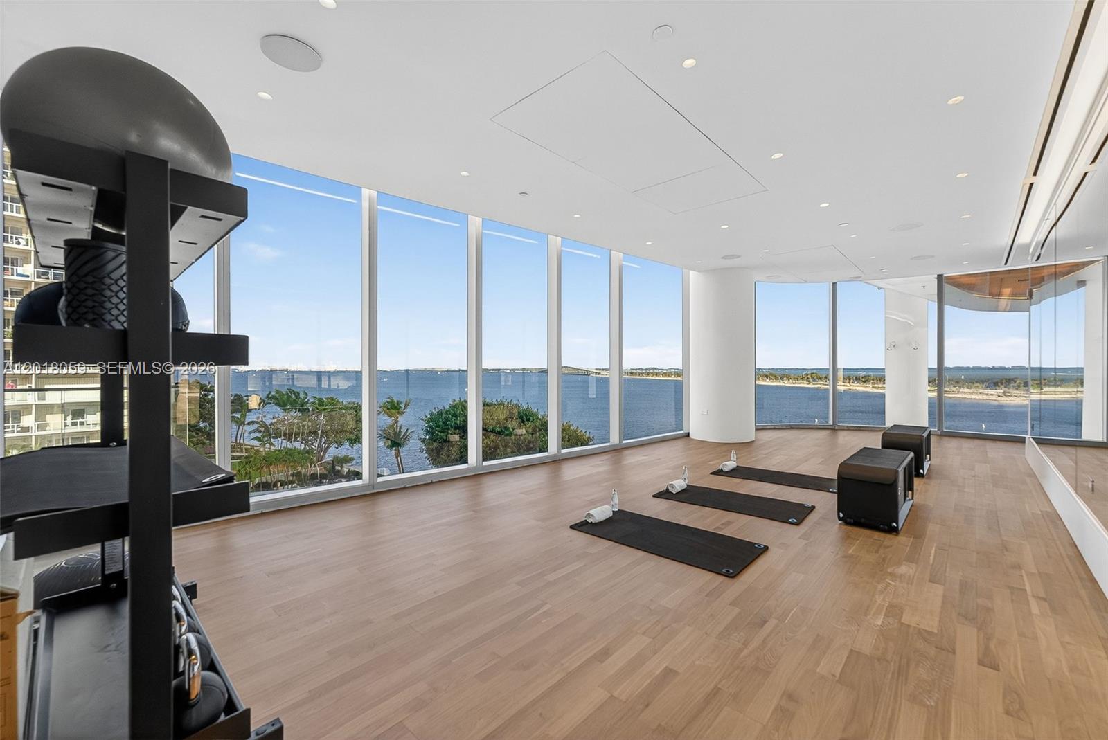175 Southeast 25th Road, Unit 1004 Miami, FL 33129 - Photo 33 of 40 a view of a room with gym equipment and floor to ceiling window