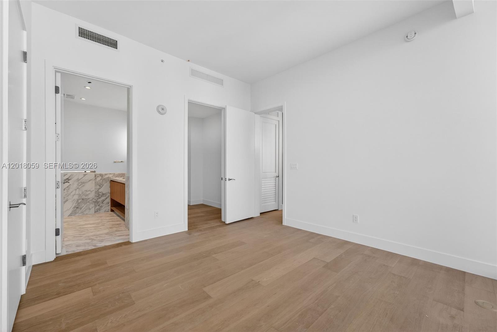 175 Southeast 25th Road, Unit 1004 Miami, FL 33129 - Photo 10 of 40 a view of a room with wooden floor
