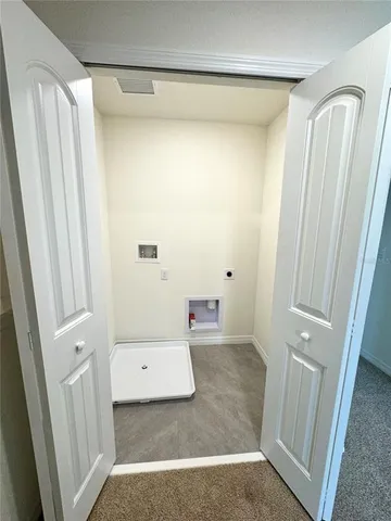 a bathroom with a sink and mirror with toilet
