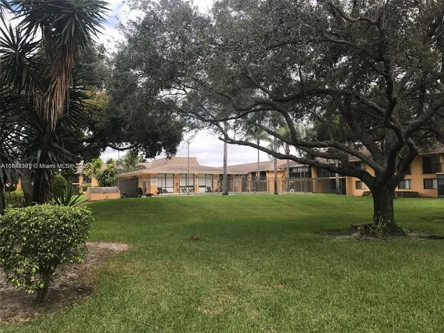 a view of a big yard next to a house