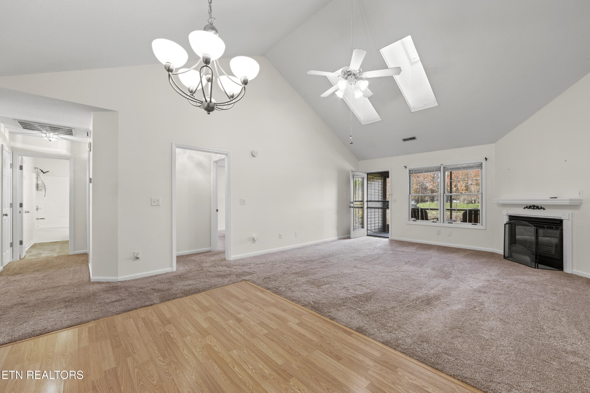 1218 Ernest McMahan Road Sevierville, TN 37862 - Photo 11 of 40 a view of an empty room with a window and fireplace