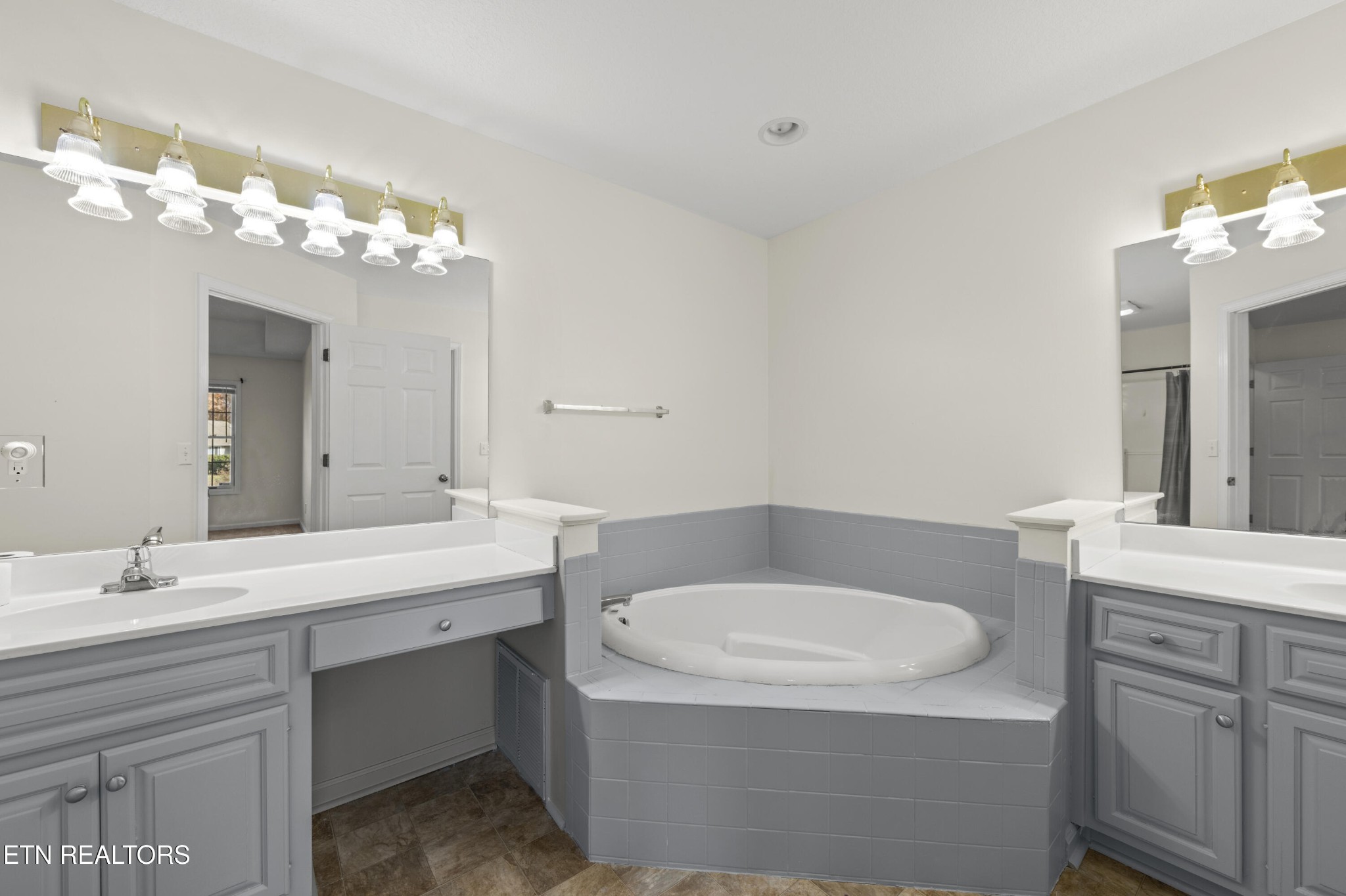 1218 Ernest McMahan Road Sevierville, TN 37862 - Photo 25 of 40 a bathroom with a sink a large mirror and a toilet