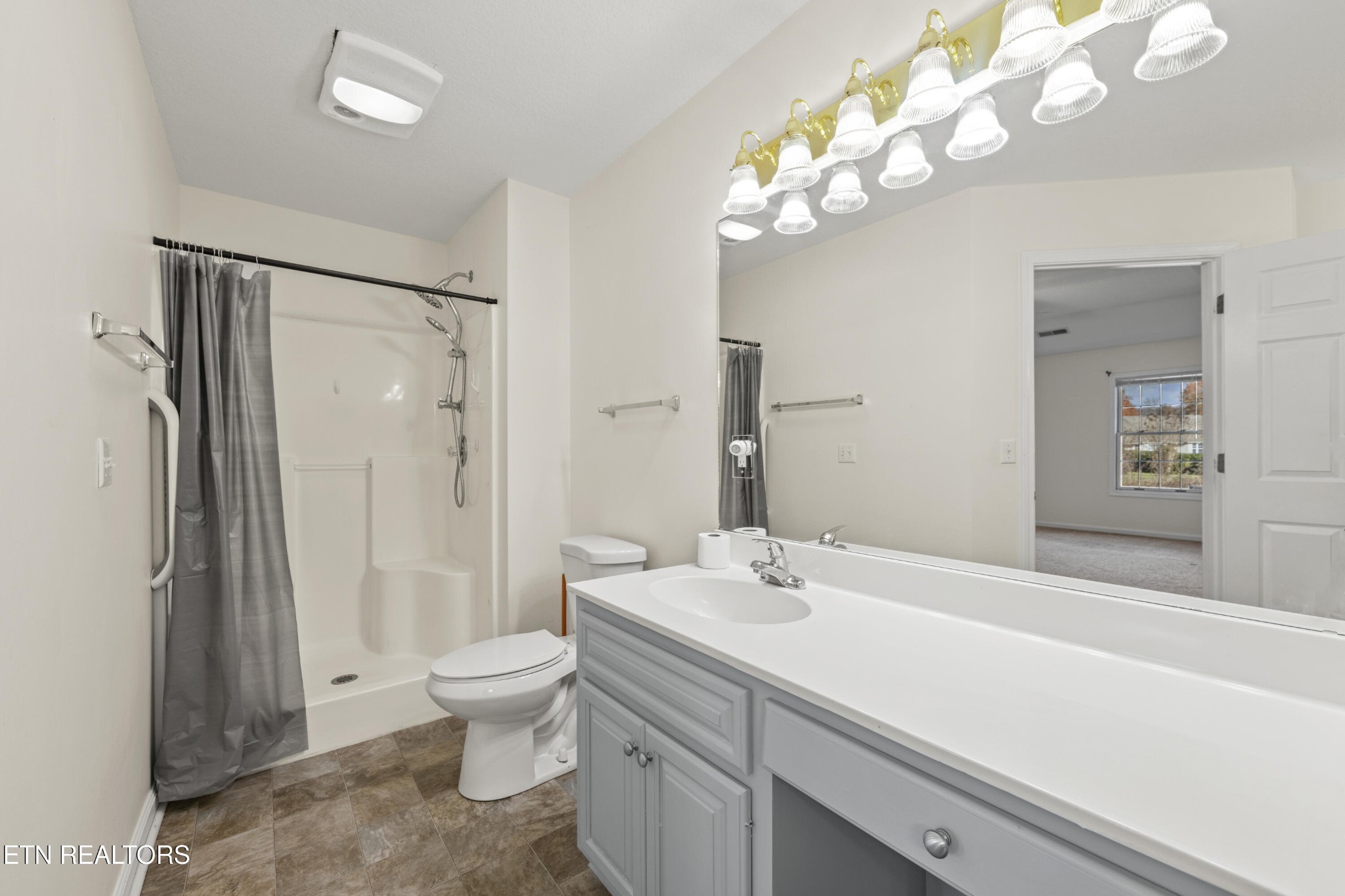 1218 Ernest McMahan Road Sevierville, TN 37862 - Photo 26 of 40 a bathroom with a sink a toilet and shower