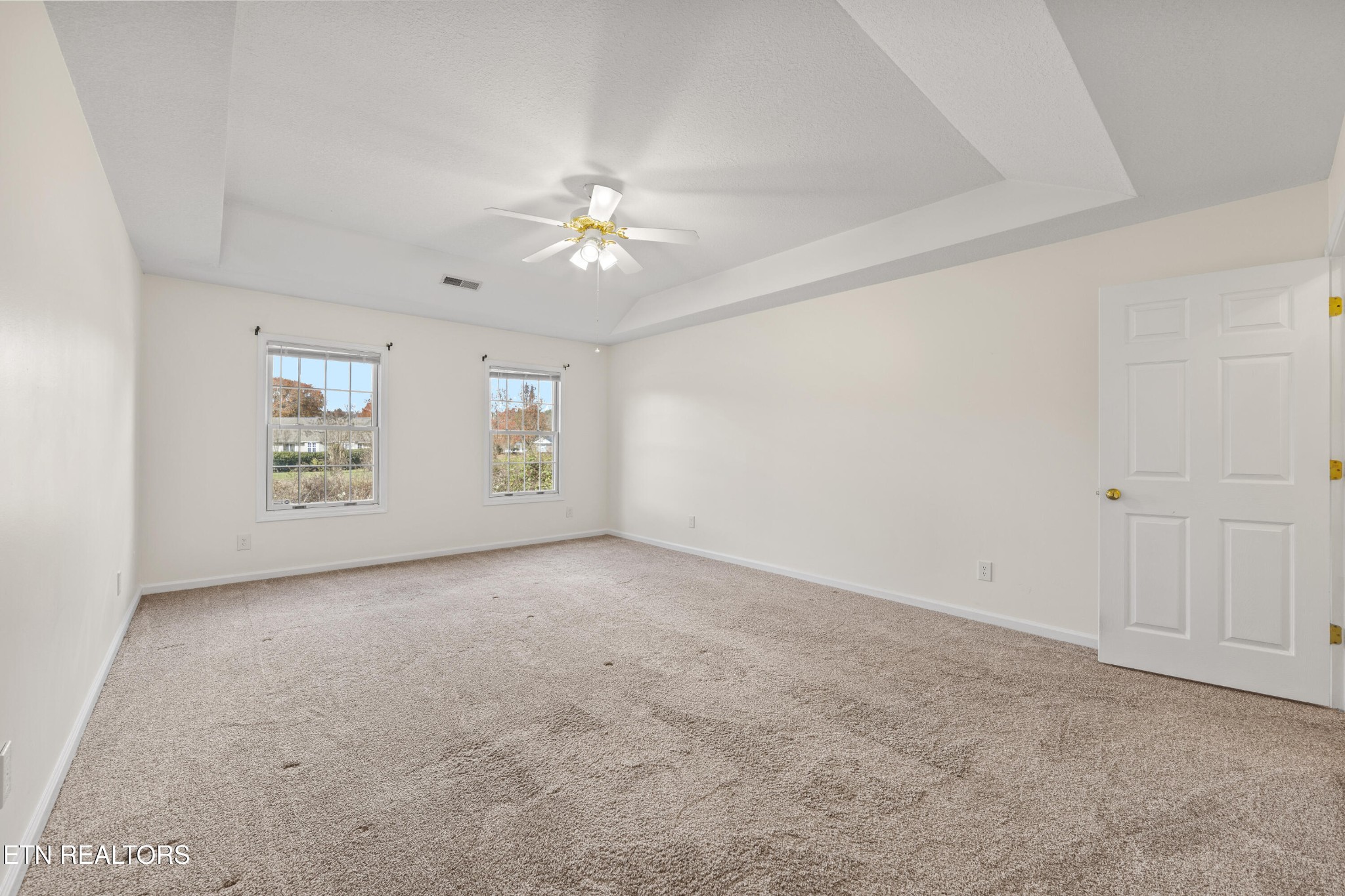 1218 Ernest McMahan Road Sevierville, TN 37862 - Photo 30 of 40 an empty room with windows and ceiling fan