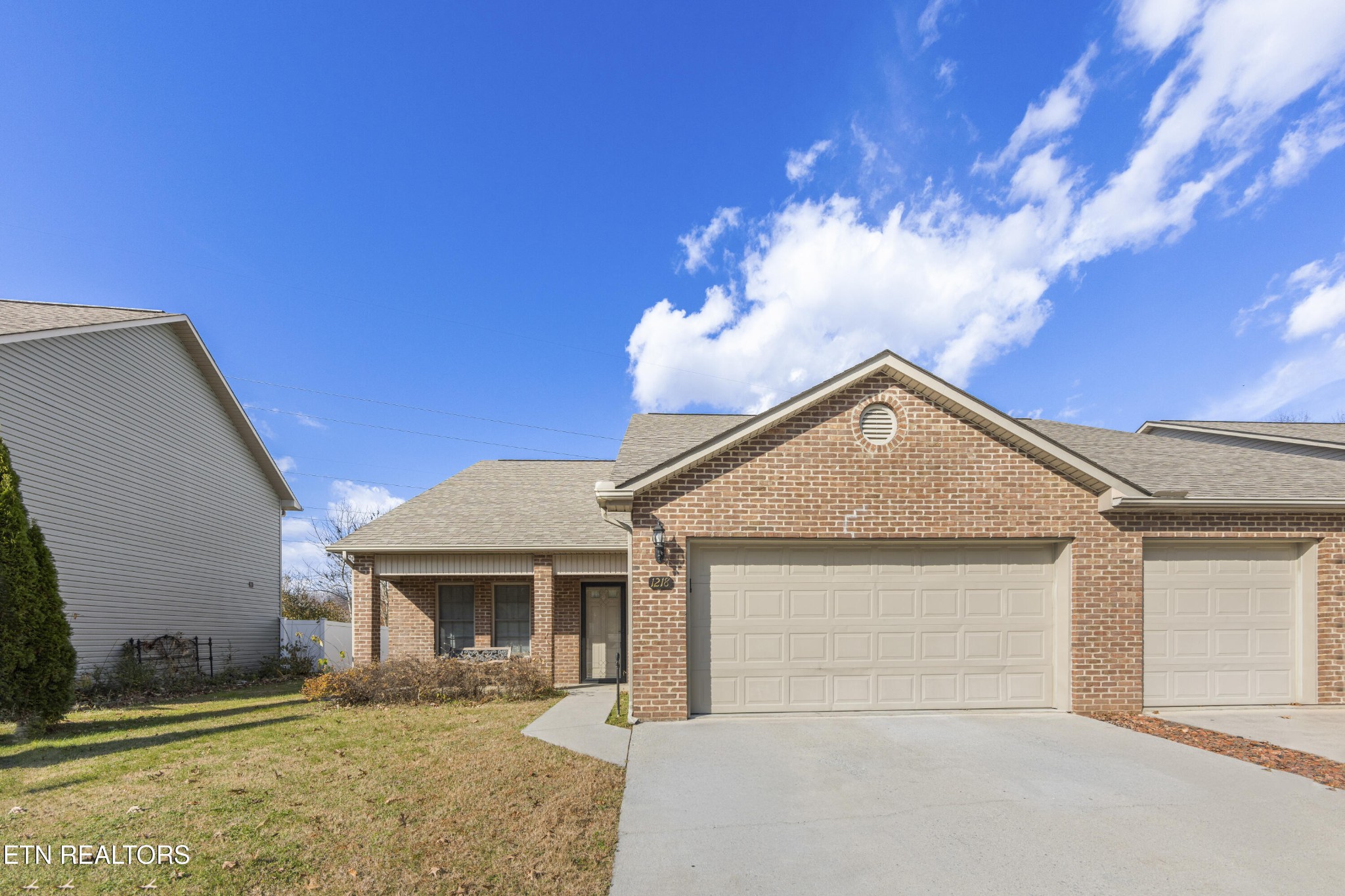 1218 Ernest McMahan Road Sevierville, TN 37862 - Photo 3 of 40 a front view of a house with a yard