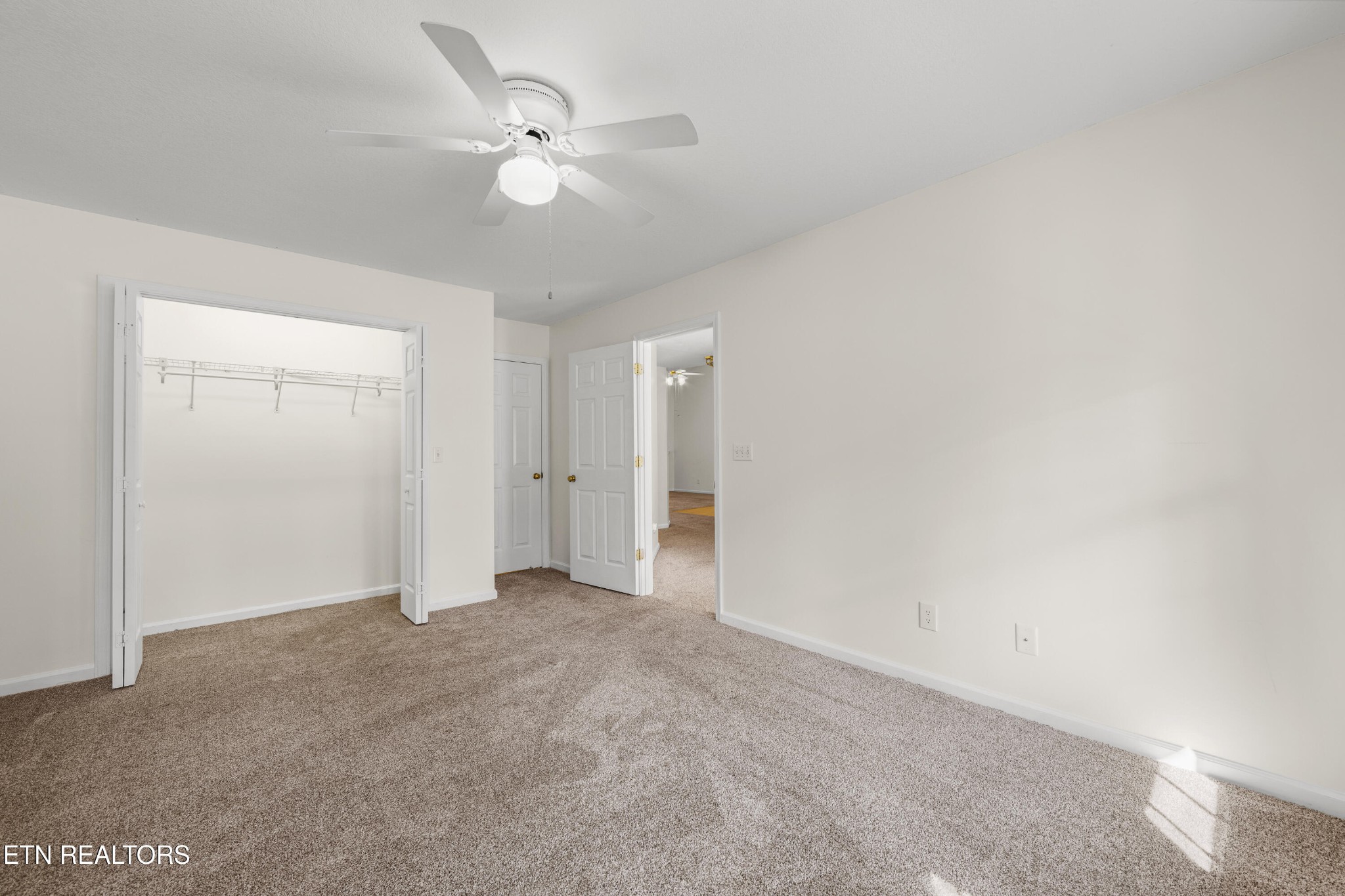 1218 Ernest McMahan Road Sevierville, TN 37862 - Photo 6 of 40 a view of an empty room with a ceiling fan