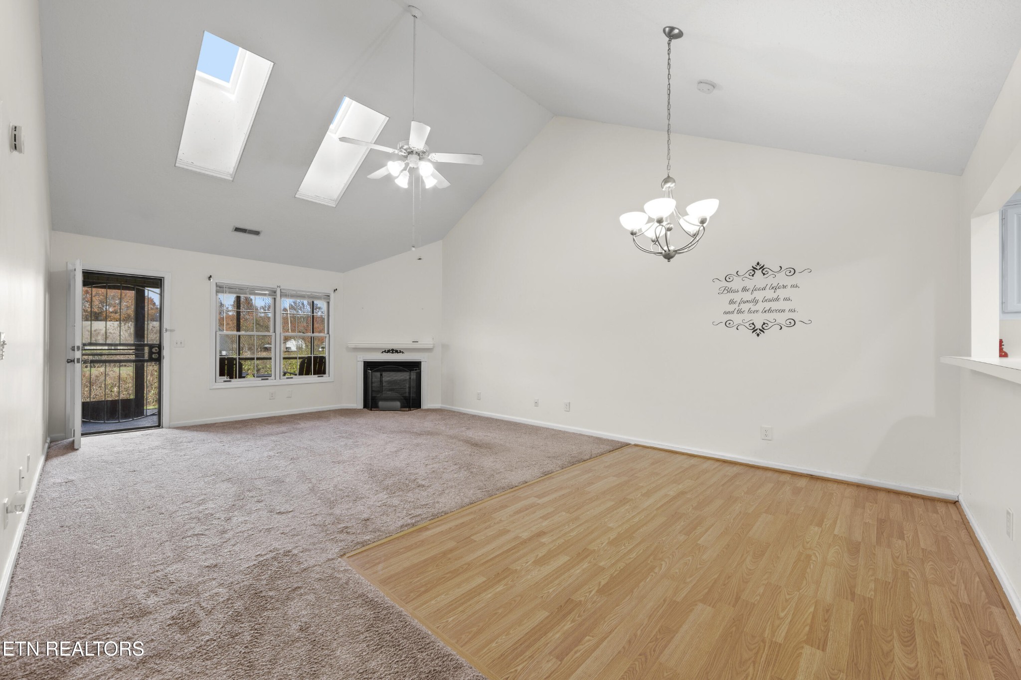 1218 Ernest McMahan Road Sevierville, TN 37862 - Photo 10 of 40 a view of an empty room with window and wooden floor