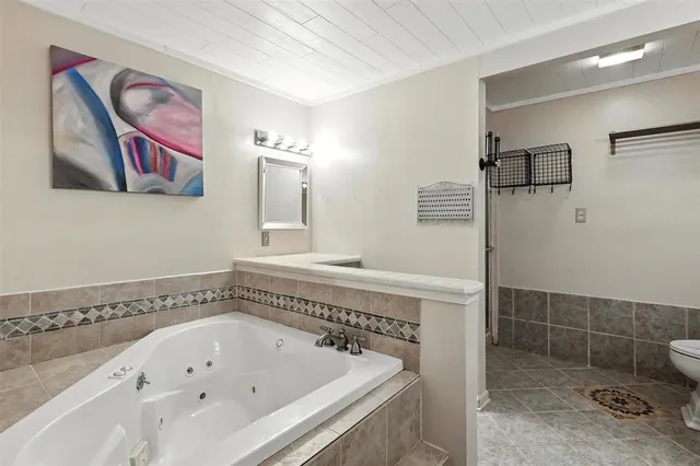 a bathroom with a bathtub and a shower