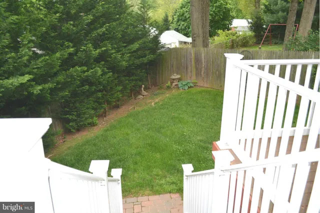 a view of backyard with a small cabin