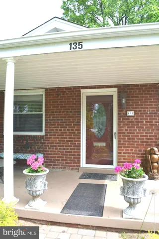 a view of a door with a bench