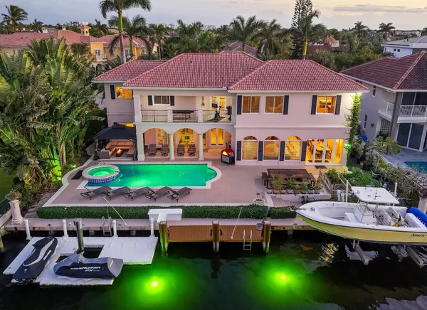 a view of a patio with table and chairs and potted plants