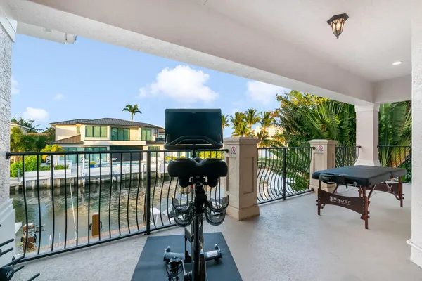 a view of a livingroom with furniture and floor to ceiling window