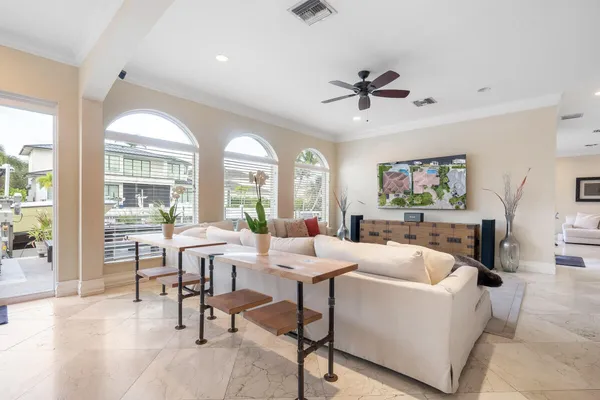 a living room with furniture and a large window