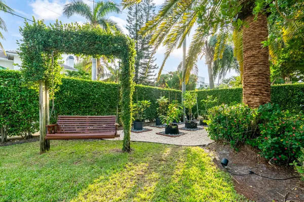 a view of a bench in a garden