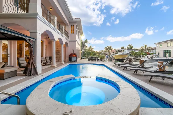 a view of swimming pool with outdoor seating