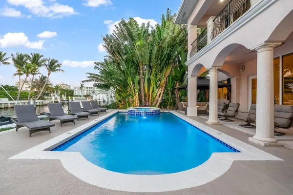 a view of a swimming pool with lounge chair