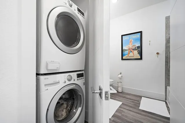 a view of a hallway with washer and dryer