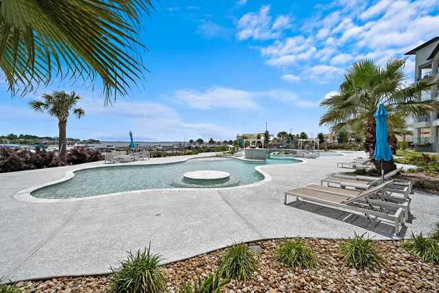 a view of a swimming pool with a table and chairs