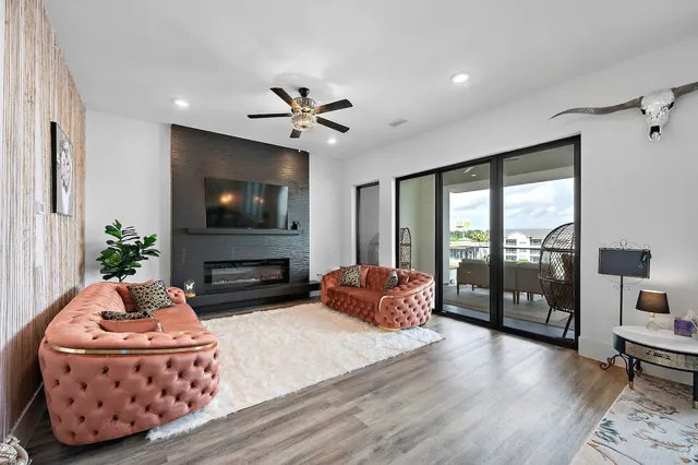 a living room with fireplace furniture and a flat screen tv