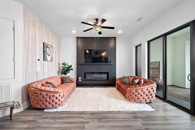 a living room with couch and a chandelier