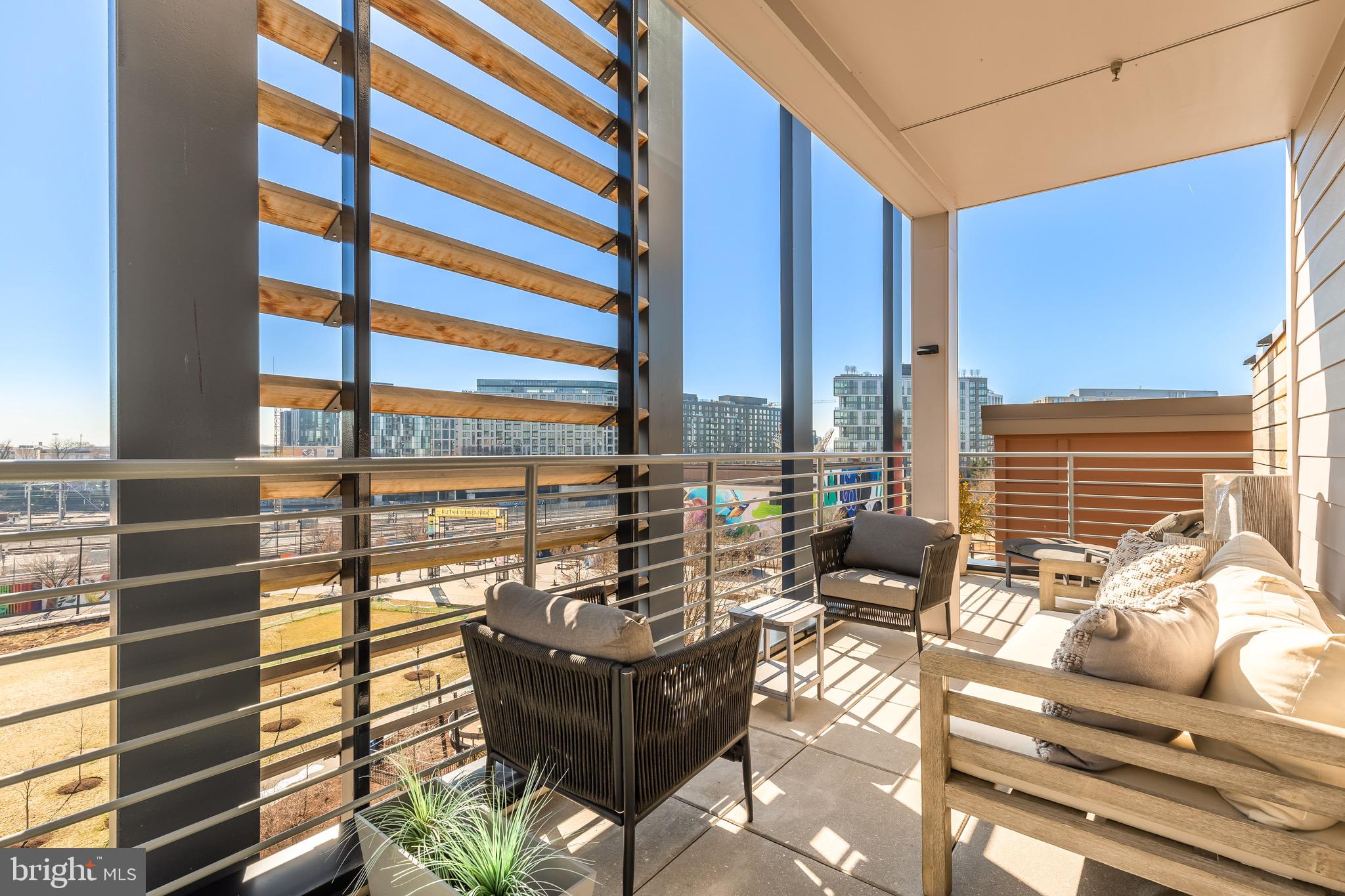 1500 Harry Thomas Way Northeast, Unit 501 Washington, DC 20002 - Photo 22 of 44 a living room with furniture and floor to ceiling windows