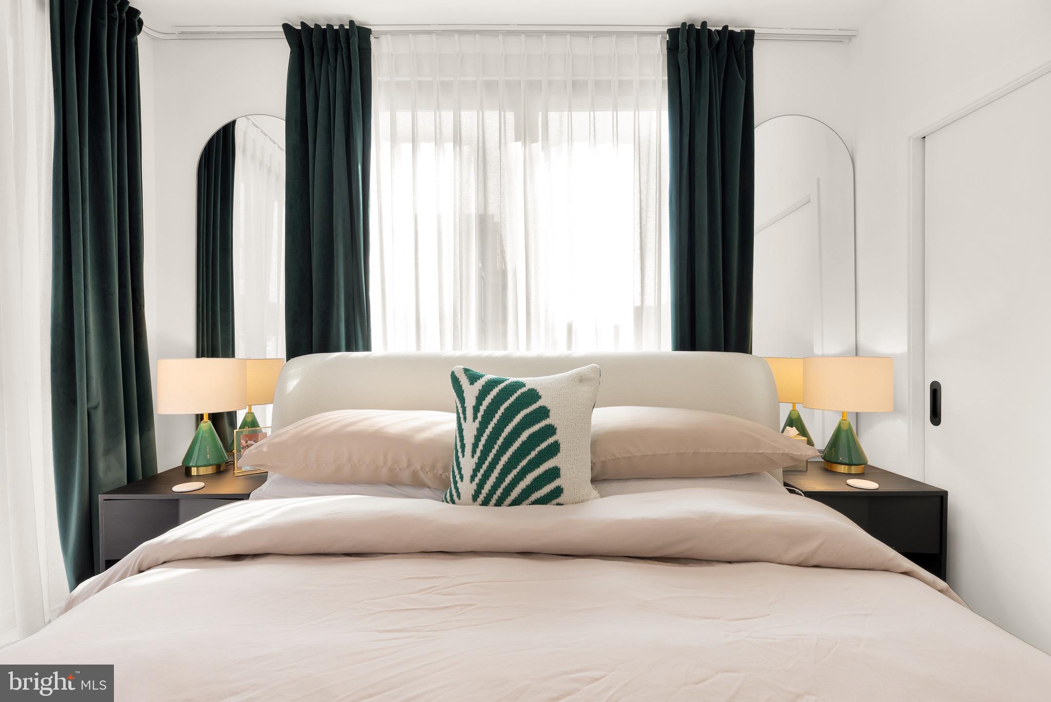 1500 Harry Thomas Way Northeast, Unit 501 Washington, DC 20002 - Photo 27 of 44 a bedroom with a bed and a large mirror