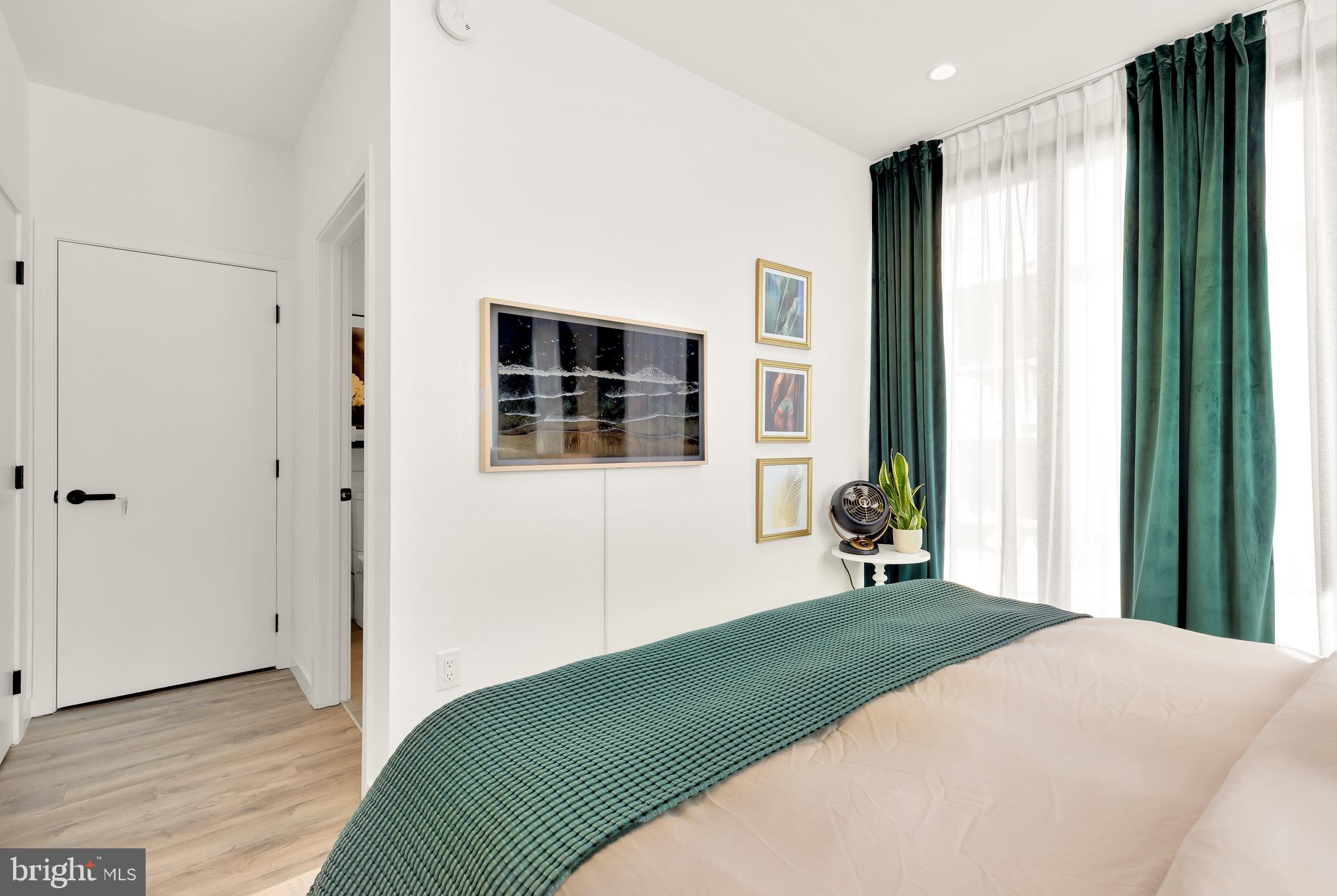 1500 Harry Thomas Way Northeast, Unit 501 Washington, DC 20002 - Photo 28 of 44 a bedroom with a bed and a window