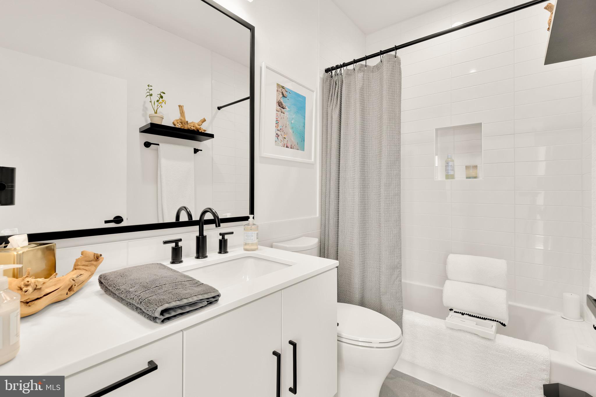 1500 Harry Thomas Way Northeast, Unit 501 Washington, DC 20002 - Photo 33 of 44 a bathroom with a sink and a toilet