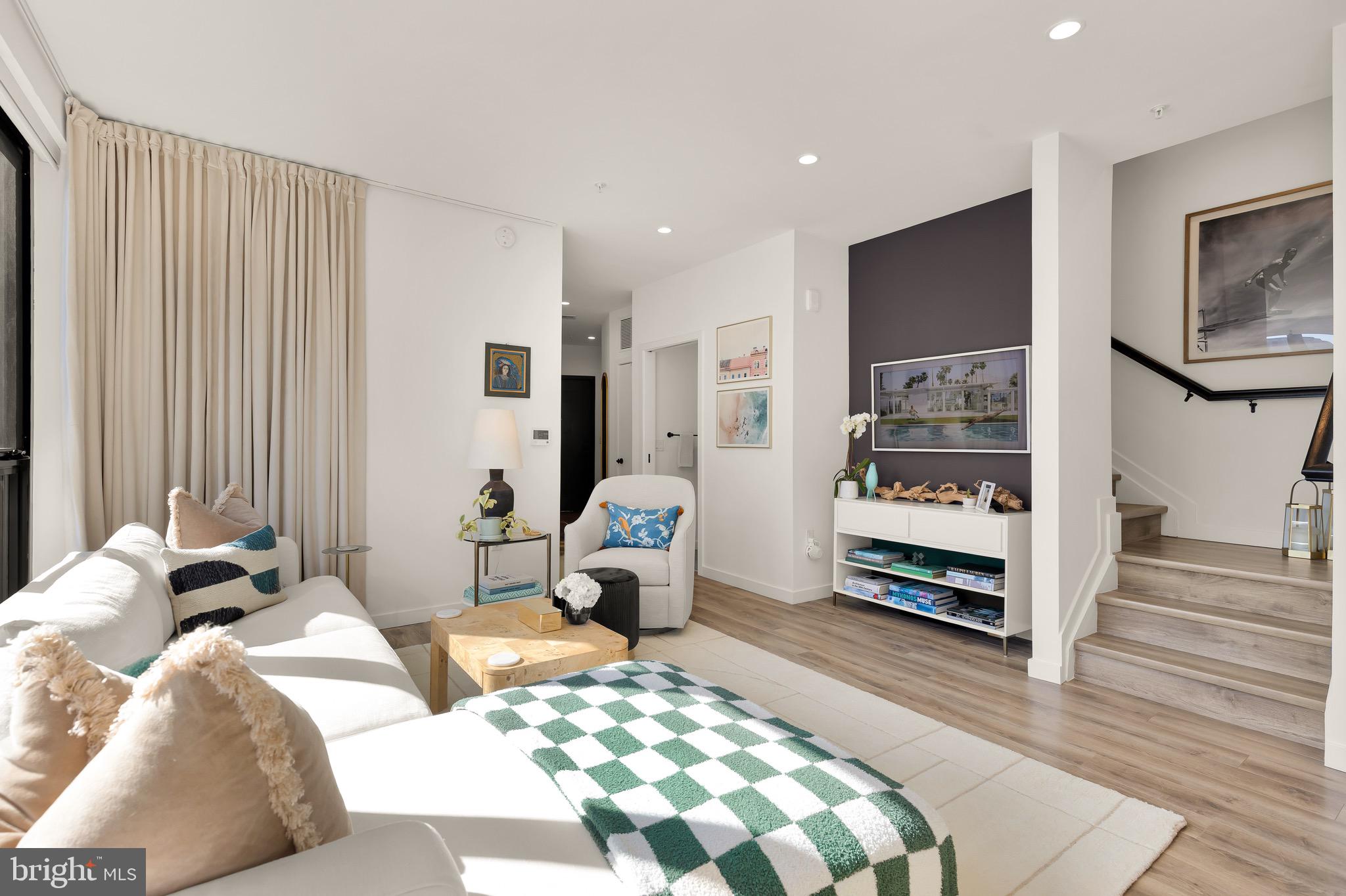 1500 Harry Thomas Way Northeast, Unit 501 Washington, DC 20002 - Photo 6 of 44 a bedroom with a bed and wooden floor