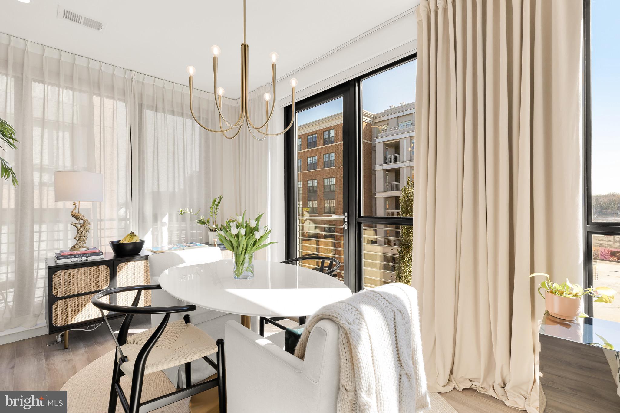 1500 Harry Thomas Way Northeast, Unit 501 Washington, DC 20002 - Photo 7 of 44 a view of a dining room with furniture window and wooden floor